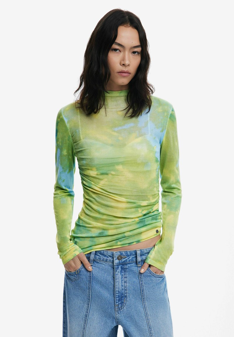 Maglietta a maniche lunghe, aderente, in un motivo a spirale verde e giallo. Tessuto morbido e elasticizzato con collo alto e dettagli arricciati.