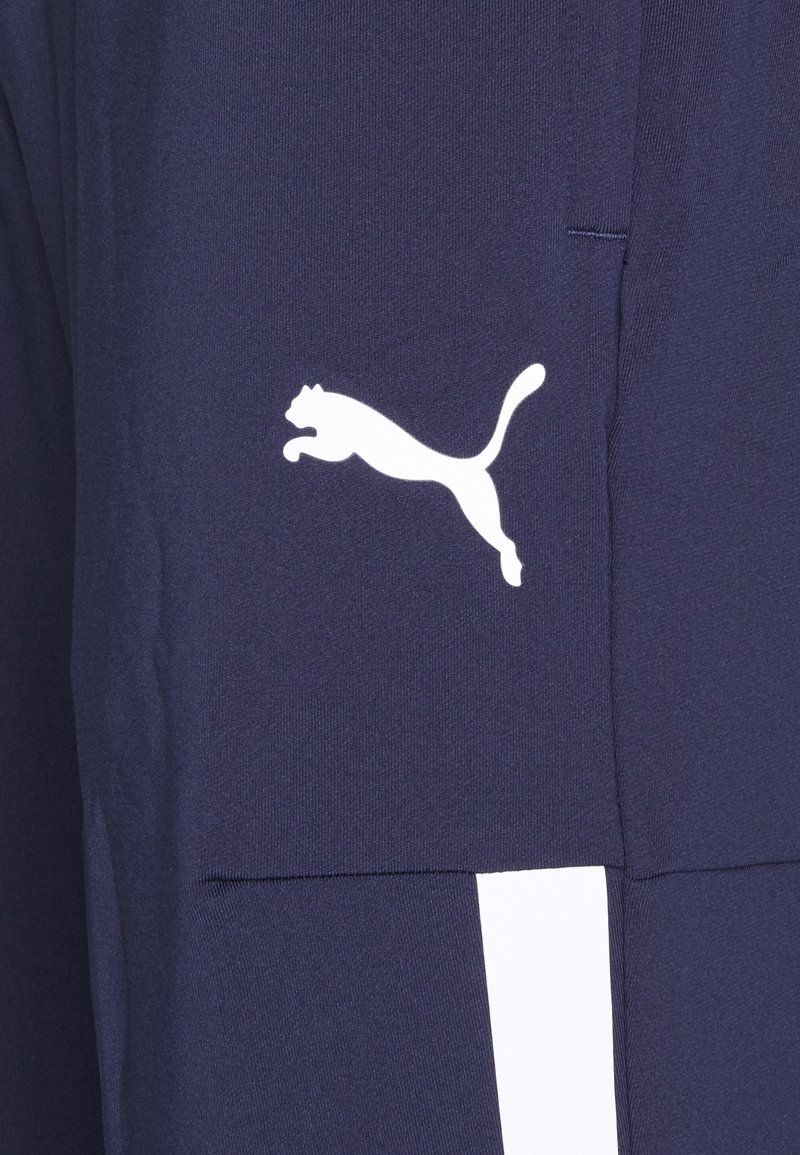 Puma TEAMLIGA TRAINING PANTS PRO - Teplákové kalhoty - peacoat/white