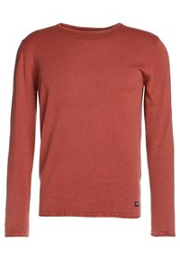 Maglietta a maniche lunghe di colore ruggine con scollo rotondo, trama a coste e orlo dritto. Presenta una piccola targhetta con logo sul lato inferiore.