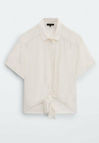 Kurzärmlige, cremefarbene Bluse mit gebundenem vorderen Teil, Knopfverschluss und subtilen Texturdetails an den Schultern. Leichtes Material.