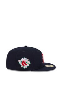 Navy baseball cap featuring embroidered red socks logo with floral accents, structured crown, and flat brim, made of textile material.