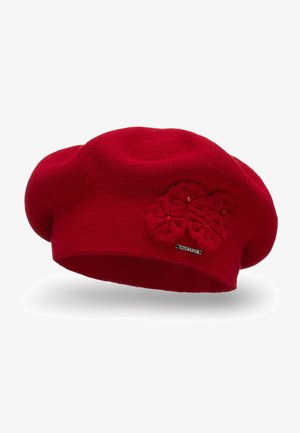 Red knit beret featuring three textured floral appliqués and a small metallic logo tag, with a soft, rounded shape.