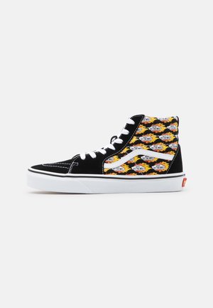 Baskets montantes Vans noir et blanc avec motif de flammes et logos "Vans Off The Wall" sur le panneau latéral, lacets blancs.