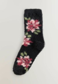 Black fuzzy sock with pink and red floral patterns accented by green leaves.