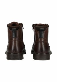 Stivali alla caviglia in pelle marrone con finitura liscia, chiusura con zip sul lato, fodera interna marrone scuro e suola in gomma testurizzata.
