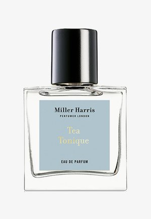 Clear glass bottle features a black cap, blue label with "Tea Tonique" in yellow text, and a minimalist design. 50ml Eau de Parfum.