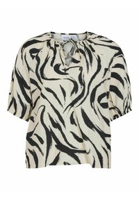 Blusa de manga corta en crema con patrón abstracto de cebra en negro, fabricada en tela ligera y con detalle de escote tipo ojo de cerradura y cierre atado.
