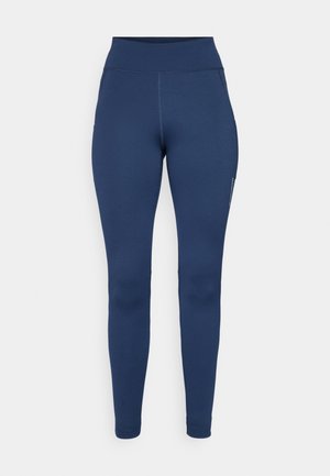 Marineblaue Leggings aus dehnbarem Stoff mit hohem Taillenbund und einer Seiten- Tasche. Glatte Textur mit flachen Nähten.