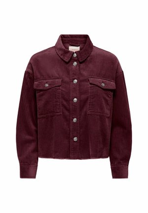 Veste en velours côtelé bordeaux avec col, fermeture à boutons, deux poches poitrine et poignets côtelés. Lignes verticales dans la texture du tissu.