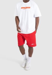 Smilodox Pantalón corto de deporte - red