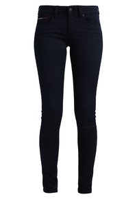 Smala jeans i mörk indigo denim, med dragkedja och knappstängning, klassisk 5-fickdesign och subtila röda sömdekorationer.