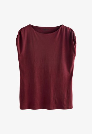 Burgundia lühikeste varrukatega pluus pehmest ja kergest kangast. Omab laeva kaelust ja kogutud õlavarre detaile. Lihtne, mugav lõige.