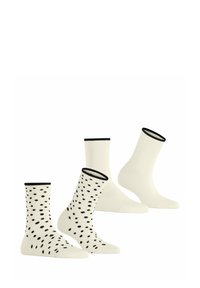 Drei Paar Socken: einfarbig in Creme, zwei mit einem schwarzen Punktmuster. Alle Socken haben schwarze gerippte Bündchen und bestehen aus weichem, strukturiertem Stoff.