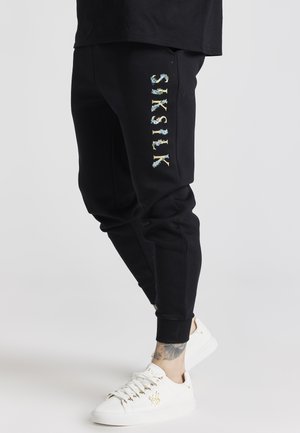 CUFFED - Pantalones deportivos - black