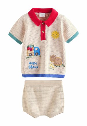 Beige knitted baby outfit with red collar, teal sleeve edges, blue hem, featuring embroidered sun, truck with vegetables, sheep with chicks, and "Home Grown" text.
