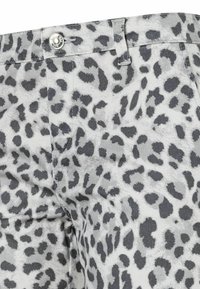 Gray and white leopard print trousers with a textured fabric. Features a front button and subtle stitching details.