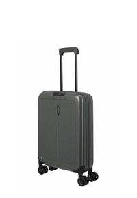 Valise rigide gris foncé avec quatre roulettes doubles pivotantes et une poignée télescopique extensible.