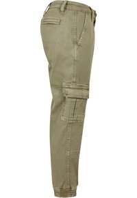 Khaki cargo bukser med sidelommer, elastiske ankelmanchetter, tætsiddende design og slidstærkt stof. Flade front- og baglommer inkluderet.
