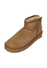 Beige Wildlederschuh mit weichem Schafslederausschlag, runder Zehenpartie und Gummisohle. Mit gestickter Naht und einem Markenlogo an der Seite.