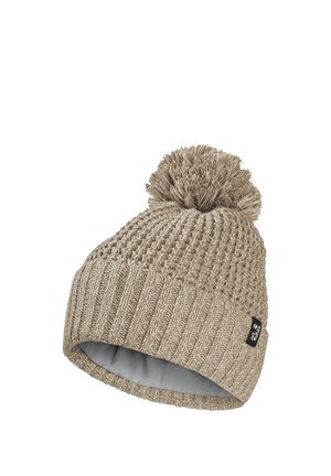 Beige knitted winter hat with pom-pom on top and ribbed cuff, featuring a small black fabric brand tag.