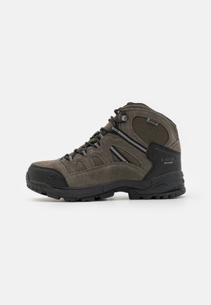 Waterproof hiking boots in dark gray suede and mesh. Mid-top design with black rubber sole, featuring reinforced toe and lace-up closure.