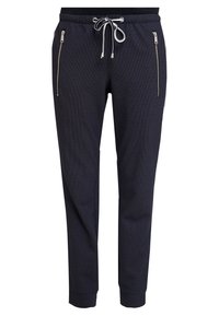 Marina strukturerade joggerbyxor med vit dragkedja, sidofickor med dragkedja, avsmalnande ben och mudd i anklarna.