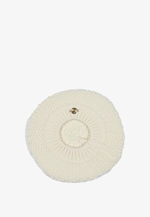 Circular, cream-colored woven bag with textured patterns, featuring a smooth, raised center and a small gold hardware detail.