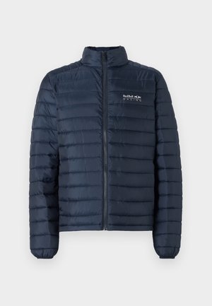 Navy padded jacket with a stand collar, front zip closure, and Red Bull Racing logo on the chest. Features horizontal quilted design.