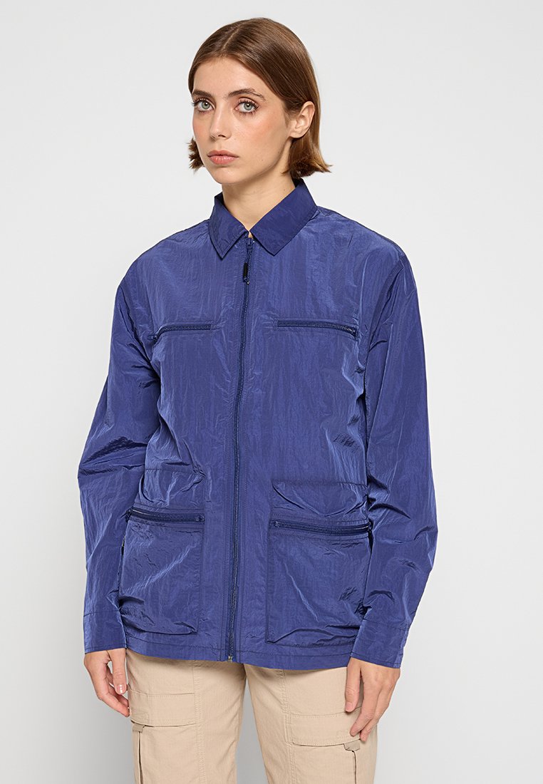 Rains Lichte jas blauw Rains Lichte jas blauw