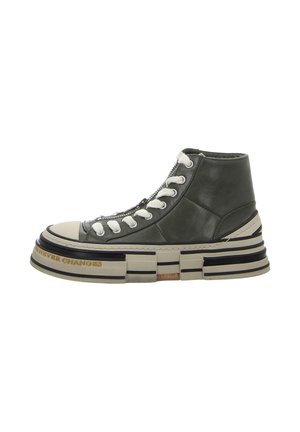 High-top sneakers in olive green leather with white laces, a round toe, and a thick, layered sole featuring black and beige stripes.