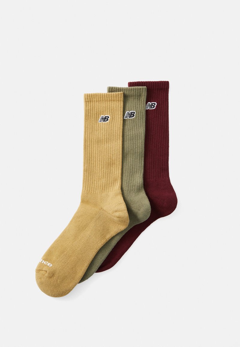 Pack of three socks: mustard yellow, olive green, and burgundy. Ribbed texture with logo on side. Cotton blend material.