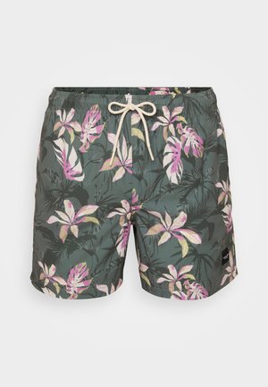Green swim trunks with a tropical floral pattern in pink and yellow. Features an elastic waistband and beige drawstring.