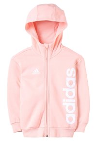 Ljusrosa huvtröja med full dragkedja. Har en vit "adidas"-logotyp tryckt vertikalt på högra sidan. Slät tygtextur.