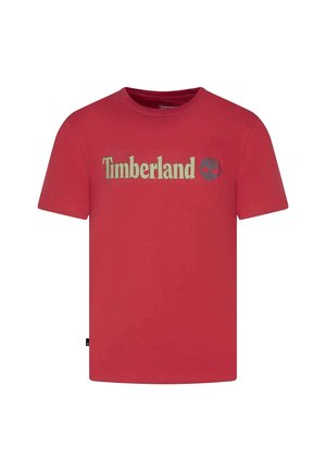 T-shirt rossa a maniche corte con scollo tondo, con testo "Timberland" beige e logo ad albero al centro del petto.