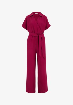 Salopetă fucsia cu un design înfășurat, mâneci scurte și un curea care se leagă singură. Dispune de pantaloni evazați și o guler. Material texturat.