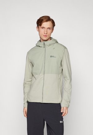 Lichtgroene, lichtgewicht jas met een ritssluiting aan de voorkant, capuchon en logo op de linkerborst. Beschikt over een twee-kleurig ontwerp en een gladde textuur.