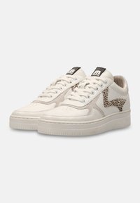White leather sneakers with suede accents, textured panels, and a leopard print detail. Features a rubber sole and classic lace-up design.