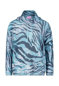 Stickad tröja med ett turkos och blått zebramönster, oversize-design med hög krage och justerbar dragsko. Texturerat tyg.