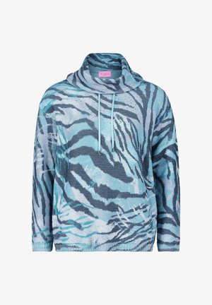 Neulepaita, jossa on turquoise ja sininen zebra-kuvio, ylisuuri malli korkealla kauluksella ja säädettävällä nauhalla. Rakennekangas.