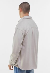 Bershka Jacka i konstläder - stone