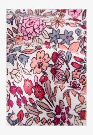 Cvetlični material z raznolikimi barvitimi cvetovi v roza, rdeči, modri in oranžni barvi na kremni podlagi z rebrasto teksturo.