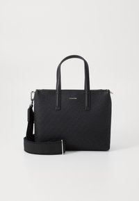 Black synthetic handbag with a rectangular shape, double top handles, and an adjustable strap. Features a textured logo pattern and silver hardware.