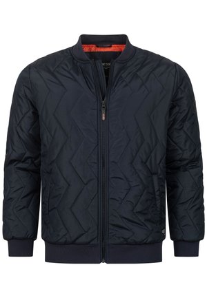 Marineblauwe gewatteerde bomberjack met een rits aan de voorkant, ribbelmanchetten en -zoom. Beschikt over een gladde textuur en een gewatteerd chevrondesign voor isolatie.
