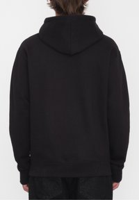 Sort hætte sweatshirt med et enkelt design. Har en justerbar hætte, lange ærmer og ribbet kant. Lavet af blødt stof.