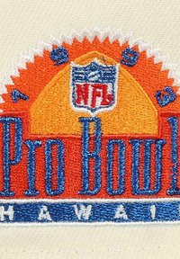 Embroidered patch featuring "Pro Bowl" in blue with orange and yellow sunburst elements and an NFL logo at the top, set on a cream background.