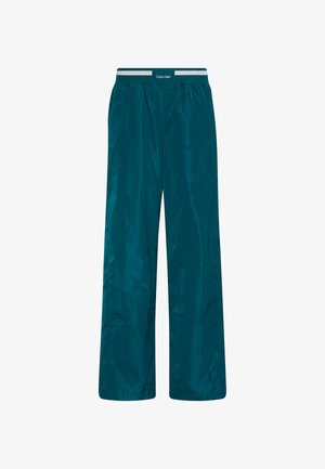 Turkooise lichte broek met een gladde textuur, een elastische tailleband met een logo, en een losse pasvorm voor comfort en bewegingsvrijheid.