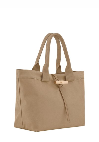 Tan fabric tote bag with two sturdy handles. Features a wooden toggle closure and a simple, rectangular design. Textured surface.