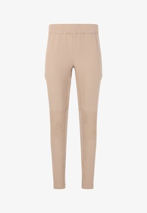 Pantalon beige ajusté avec taille élastique, genouillères et poches latérales, conçu pour une coupe près du corps et fuselée.