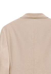 Beige strukturiierte Jacke mit Kragen, gekennzeichnet durch ein sauberes Rückendesign und sichtbare Nähte entlang der Säume.