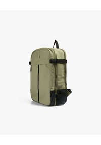 Sac à dos rectangulaire vert clair avec des sangles noires, des boucles, une couture frontale verticale et un petit logo de crâne près du centre supérieur.